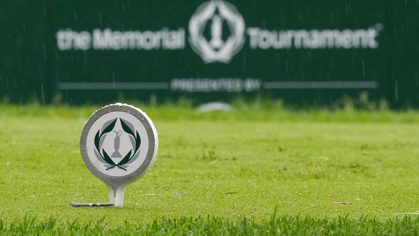 The Memorial Tournament tee marker at Muirfield Village Golf Club in the rain